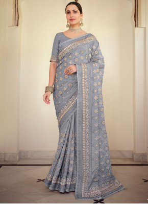Impeccable Embroidered Lavender Georgette Satin Traditional Saree